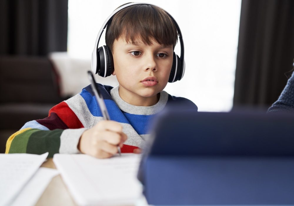boy-in-headphone-during-homeschooling-2021-08-31-22-23-55-utc-min.jpg